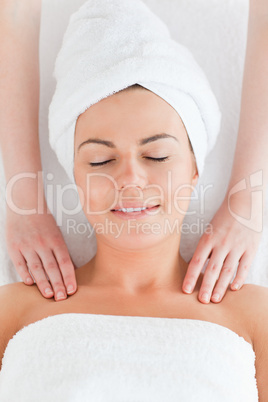 Happy woman enjoying a shoulder massage