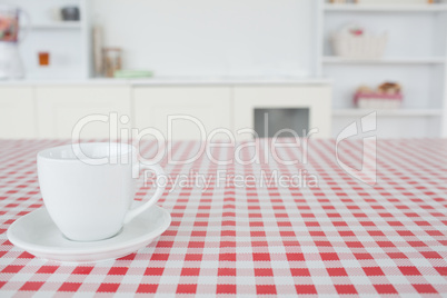 A cup of tea on a tablecloth