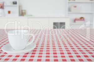 A cup of tea on a tablecloth