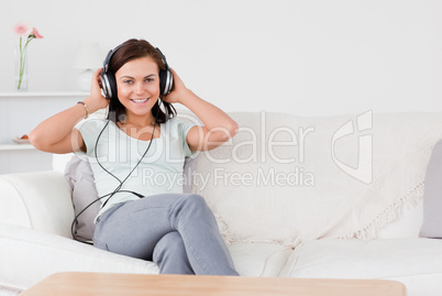 Beautiful brunette listening to music