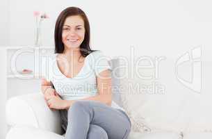 Young woman posing on the sofa