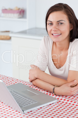 Portrait of a charming woman with a laptop