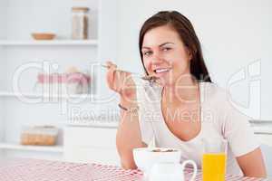 Beautiful woman eating her cereal