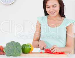 Woman slicing a pepper