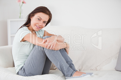 Cute woman posing on her sofa