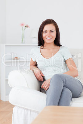 Portrait of a young woman posing on the sofa