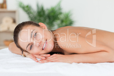 Woman lying on her belly waiting for a massage