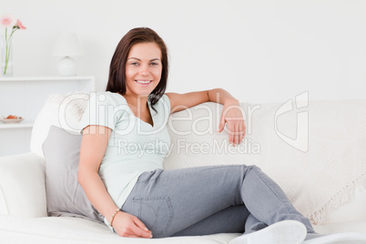 Beautiful woman sitting on a couch