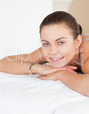Portrait of a woman lying on a massage table