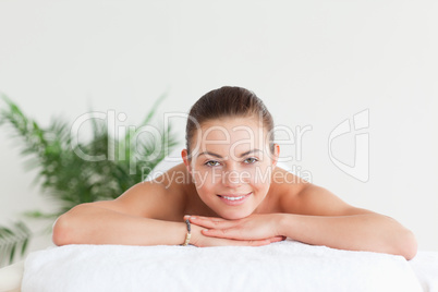 Brunette lying on a massage table