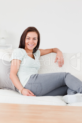 Smiling woman sitting on a couch