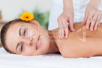 Beautiful woman having a shoulder massage