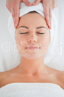 Portrait of a cute woman having a facial massage