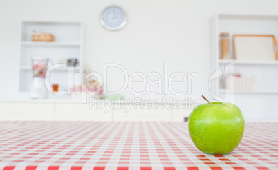 An apple on a tablecloth
