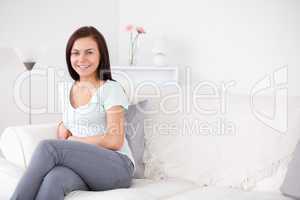 Young woman sitting on a sofa