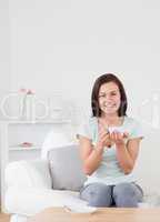 Dark-haired woman drinking tea