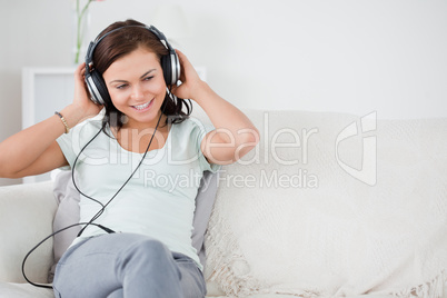 Cute brunette listening to music