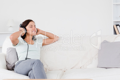 Good looking brunette listening to music