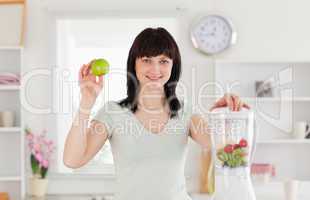 Charming brunette female posing while standing