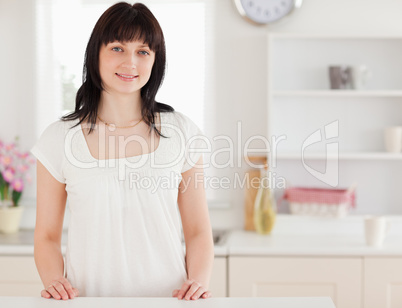 Lovely brunette female posing while standing