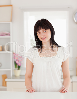 Cute brunette female posing while standing