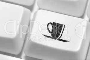 The button with an emblem of a cup of coffee on the keyboard. A