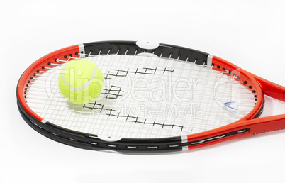 Tennis racket with a ball on a white background.