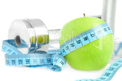 Dumbbells and apple. A healthy way of life