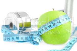 Dumbbells and apple. A healthy way of life