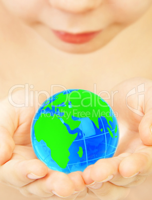 boy holds globe in hands