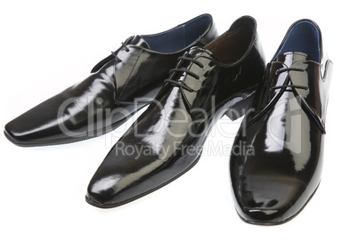 Three man's boots on a white background Three man's boots on a white background