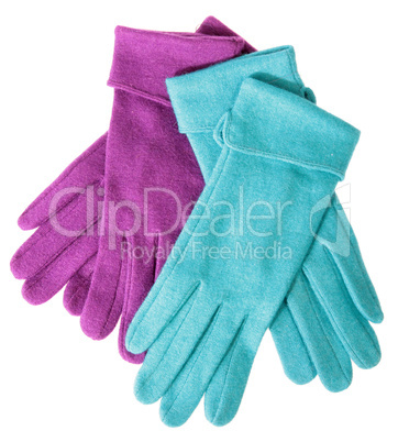 Multi-coloured woollen gloves on a white background