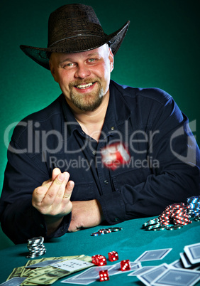 man throws dice on a green background
