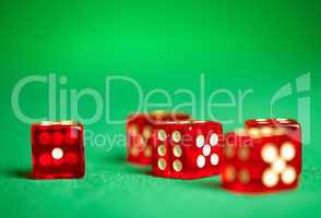 red dices on green cloth