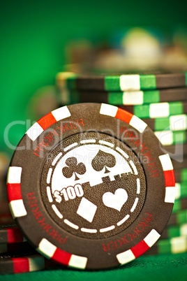 gambling chips on green cloth