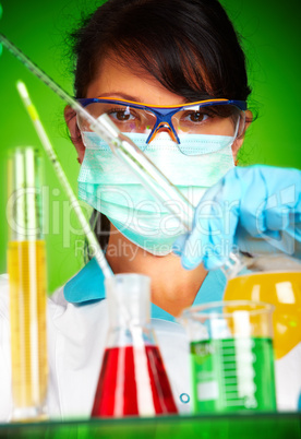 scientist in laboratory with test tubes