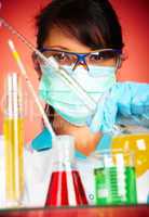 scientist in laboratory with test tubes