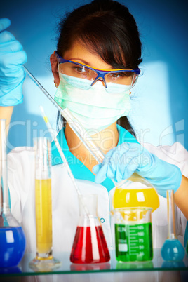 scientist in laboratory with test tubes