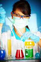 scientist in laboratory with test tubes