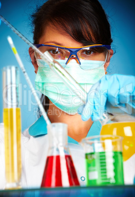 scientist in laboratory with test tubes