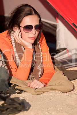 Camping happy woman lying in tent alone