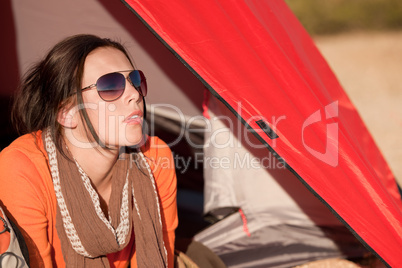 Camping happy woman lying in tent alone