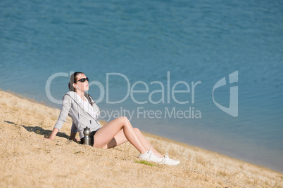 Summer sport fit woman sitting on beach