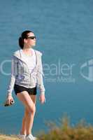 Summer sport fit woman walk on beach