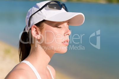Summer sport woman with cap enjoy sunset