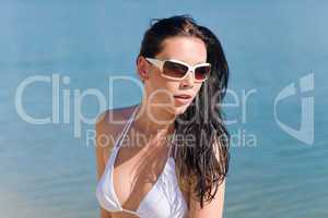 Young sexy bikini model with white sunglasses
