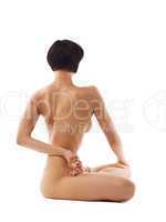 Young beauty naked woman sit in yoga pose isolated