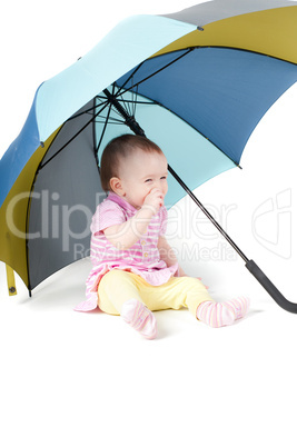 Cute baby girl under umbrella