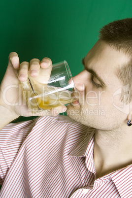 Close-up guy drinking an alcoholic beverage