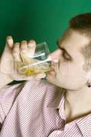Close-up guy drinking an alcoholic beverage